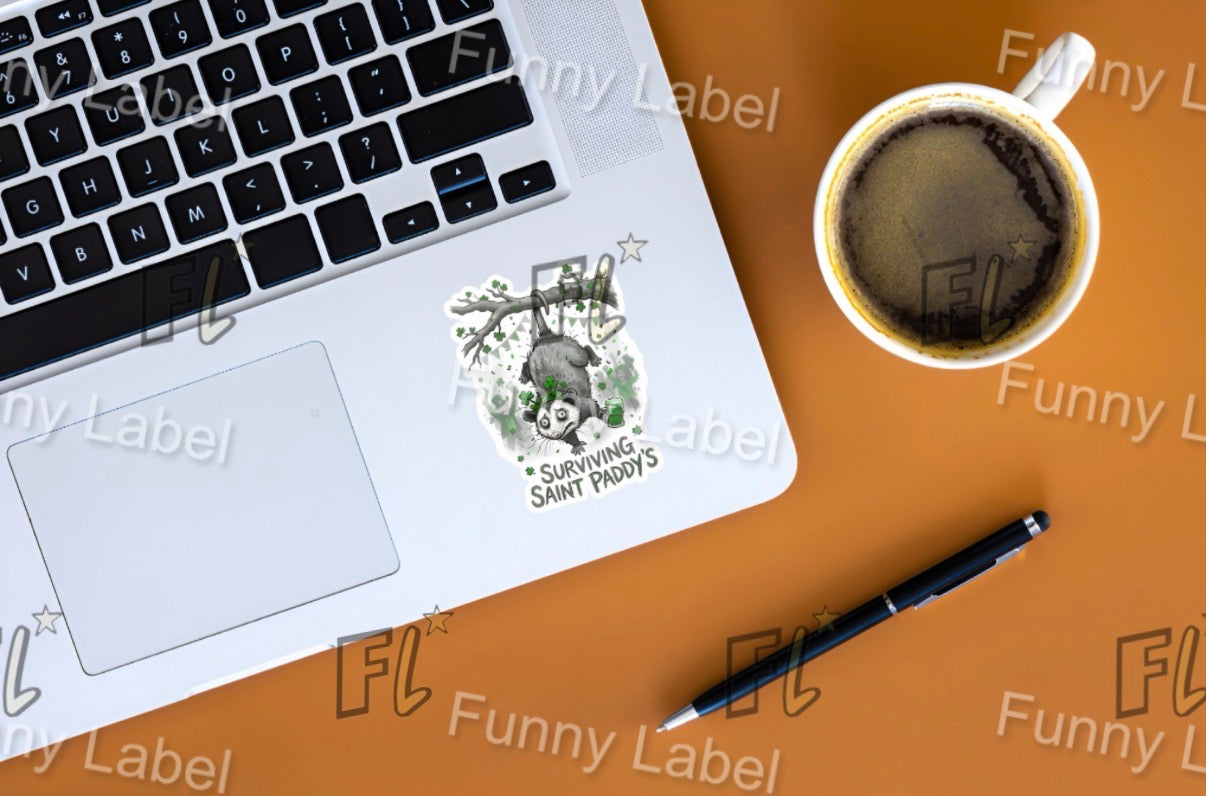 Laptop with a sticker on a brown surface next to a cup of coffee and a pen.