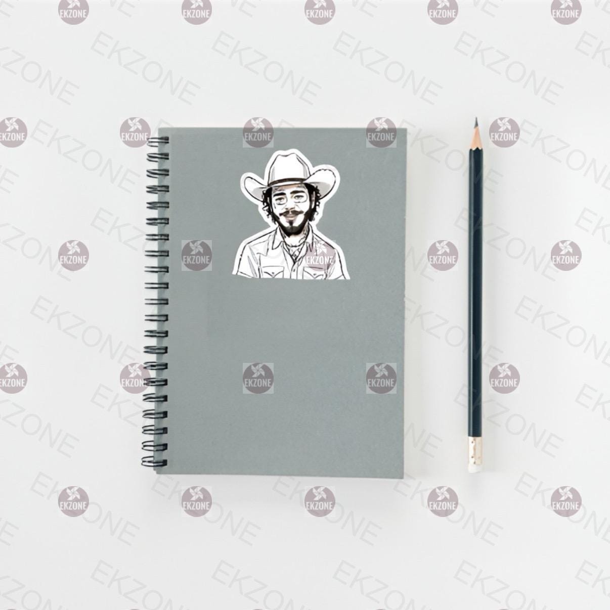 Notebook with a Post Malone sticker and a pencil on a white background.