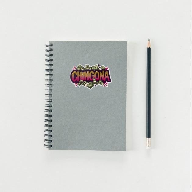 Notebook with 'Chingona' design and a pencil on a light gray background