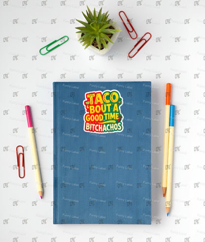 Blue notebook with colorful text design on a white surface with stationery items.
