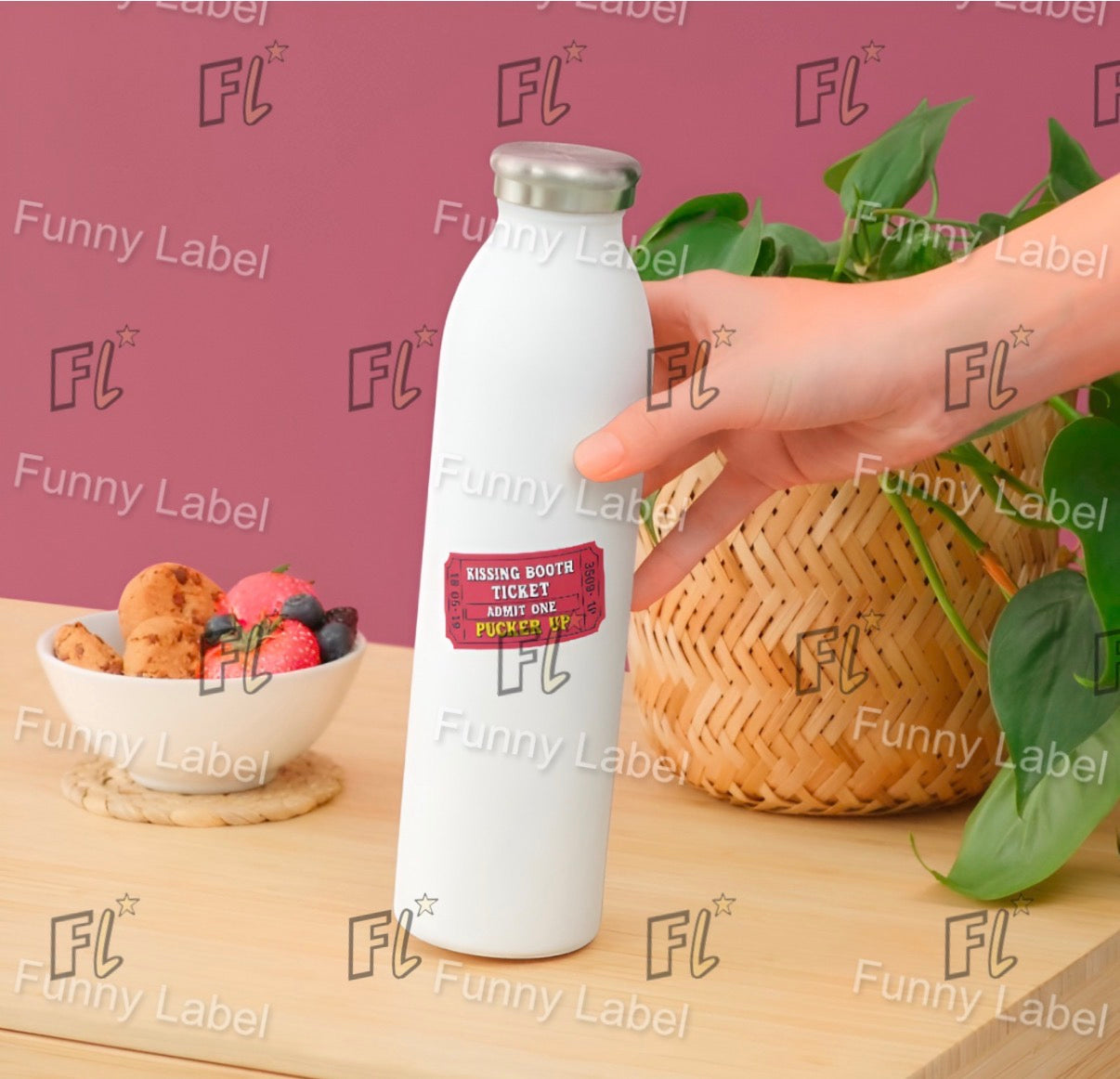 White bottle with a label held by a hand on a wooden surface with a bowl of fruit and basket in the background, branded with 'Funny Label'.