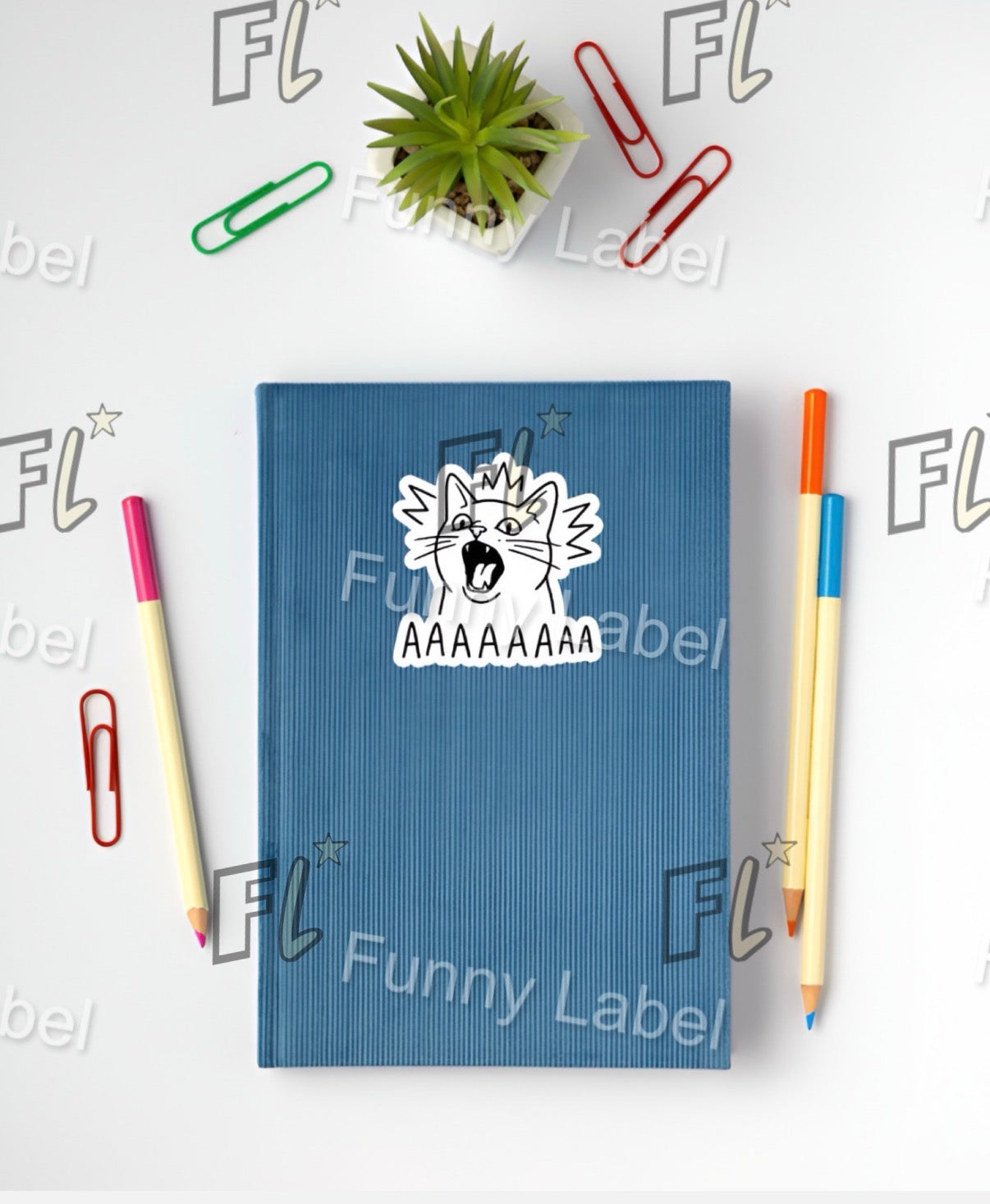 Blue notebook with a sticker on a white background with stationery items