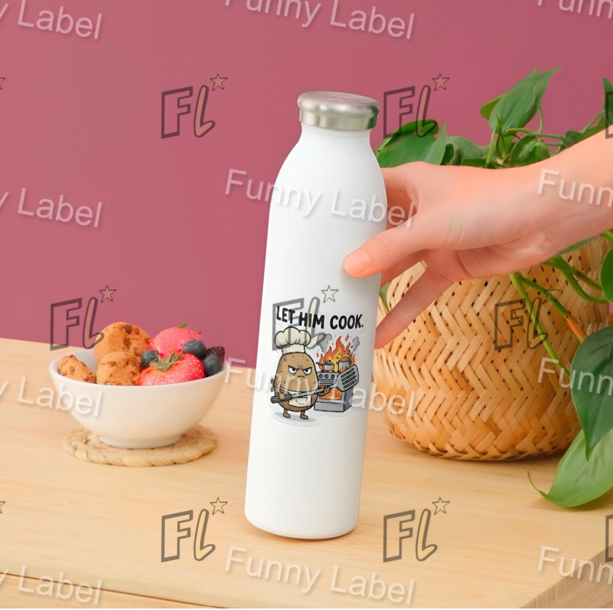 White water bottle with cartoon design held by a hand on a wooden table with food and plants.