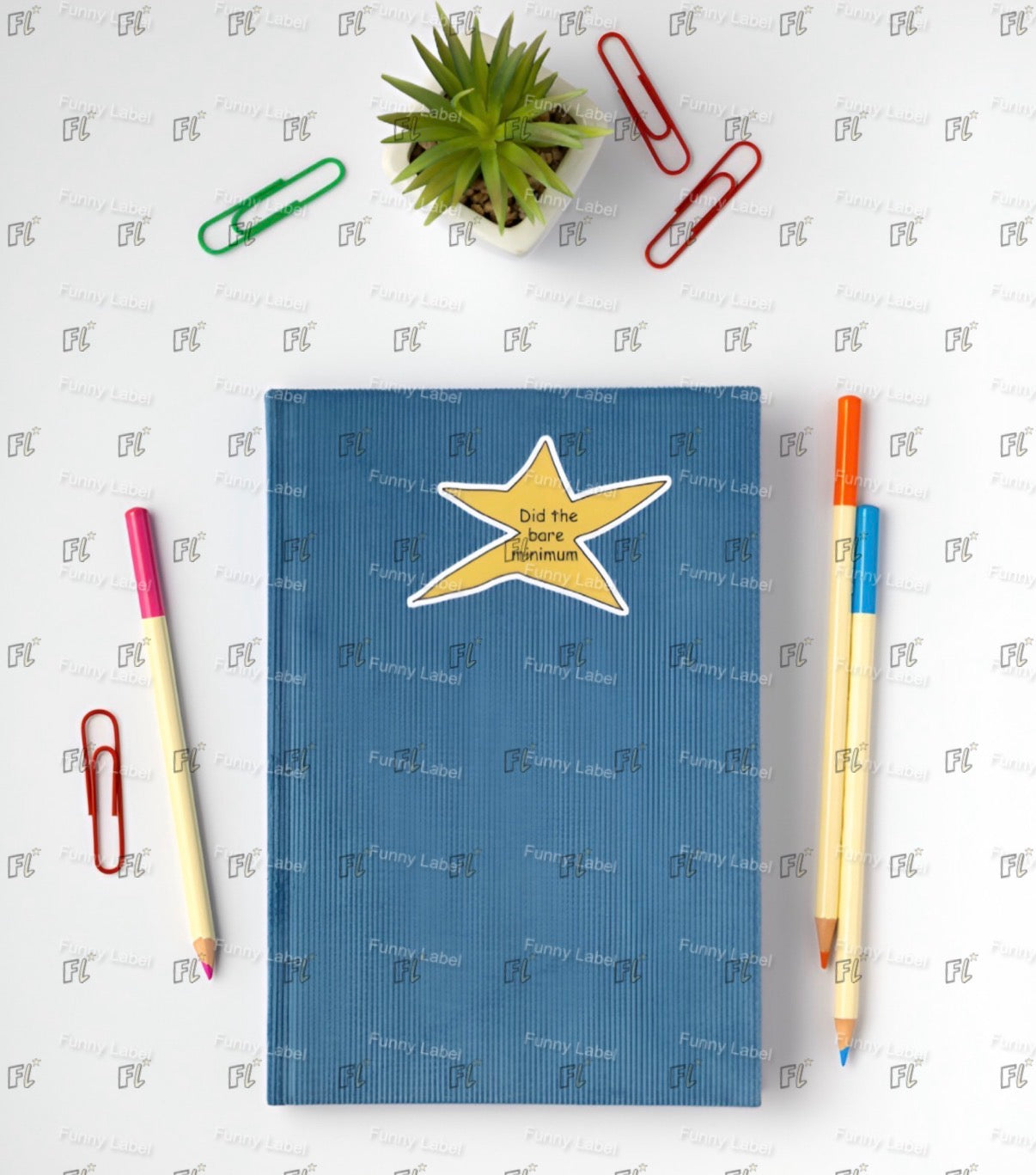 Blue notebook with a yellow star design on a white background with stationery items.