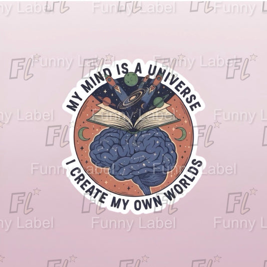 Sticker with brain and book design, text 'My mind is a universe. I create my own worlds', on a light pink background with 'Funny Label' watermark.
