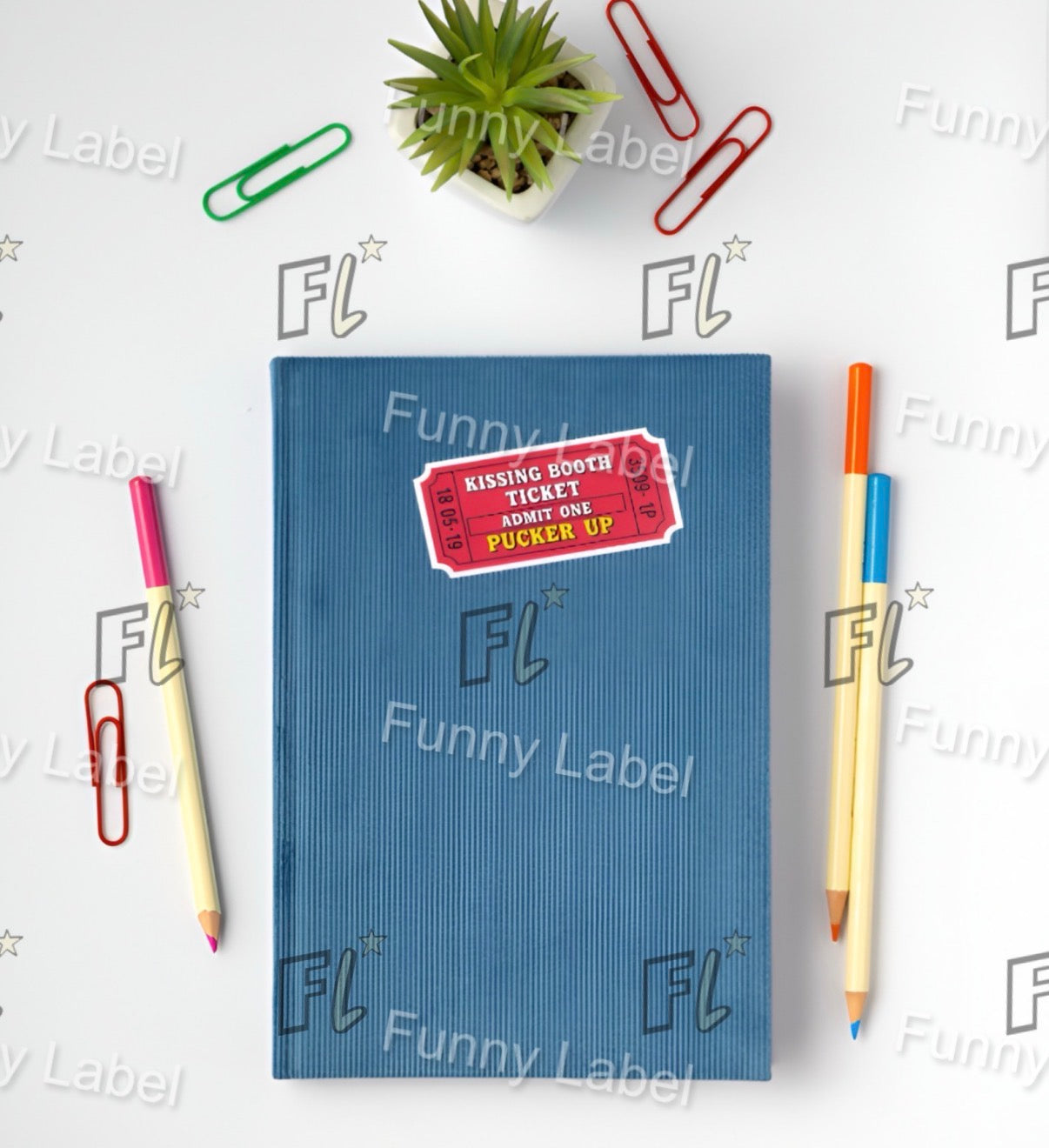 Blue notebook with a red label on a white background with stationery items and 'Funny Label' branding.
