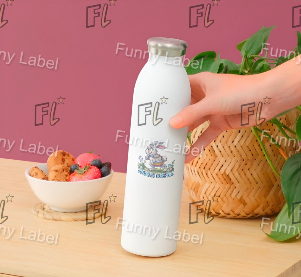 White water bottle with 'FL' branding held by a hand on a table with snacks and plants.