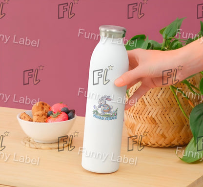 White water bottle with 'FL' branding held by a hand on a table with snacks and plants.
