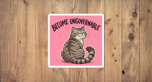 A flat, square vinyl sticker based on image.png featuring a charming cartoon illustration of a smug grey tabby cat sitting down and looking backward with a defiant, self-satisfied smile on a solid pink background under the bold arched text "BECOME UNGOVERNABLE".