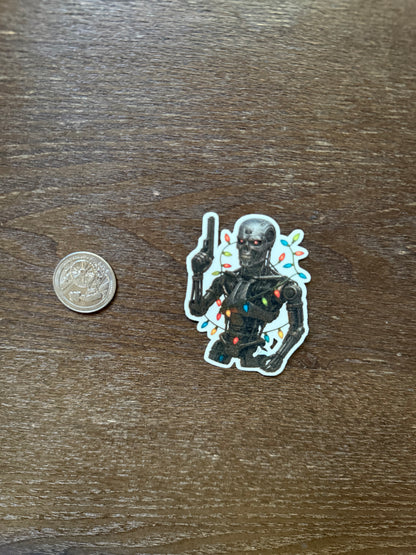 Terminator Christmas Lights Sticker – T-800 Robot Skull Holiday Label with Gun & Festive Lights