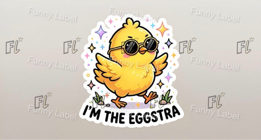 Sticker of a yellow chick wearing sunglasses with 'I'm the Eggstra' text on a gray background with 'Funny Label' branding.
