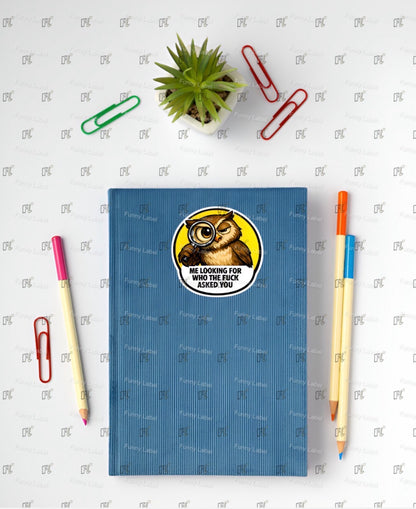 Blue notebook with an owl sticker on a white background with stationery items.