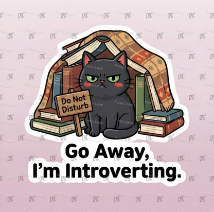 Cartoon cat surrounded by books with a 'Do Not Disturb' sign and text 'Go Away, I'm Introverting.' on a light purple background.