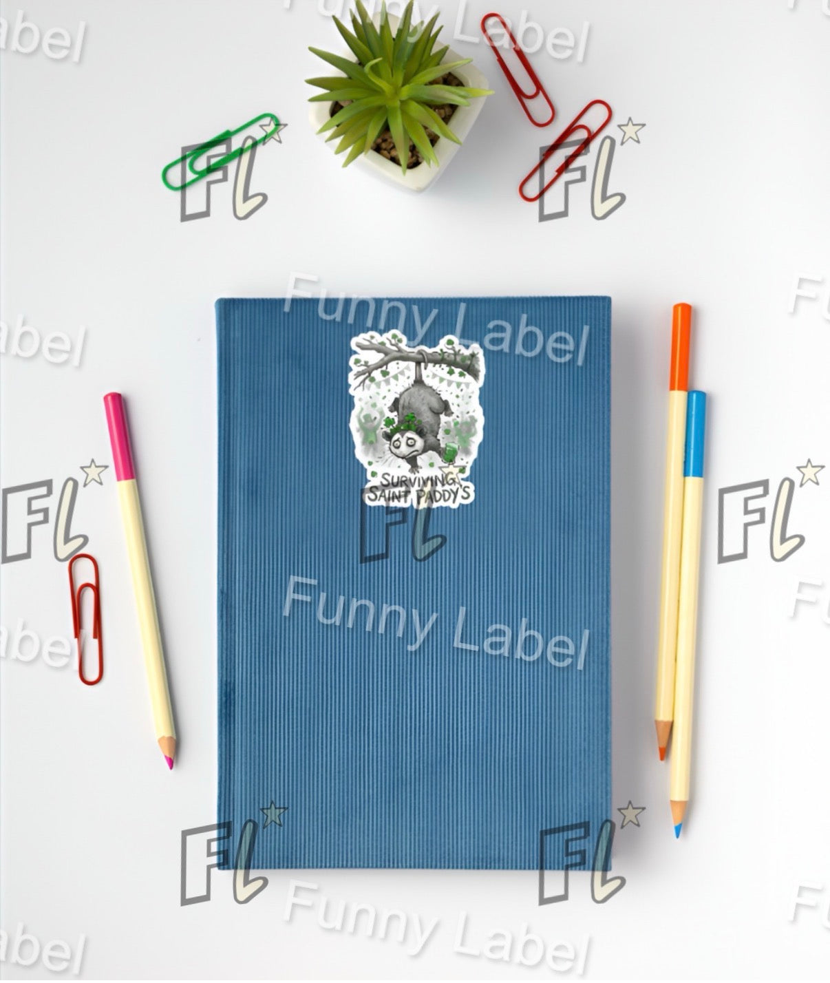 Blue notebook with stickers on a white background with stationery items