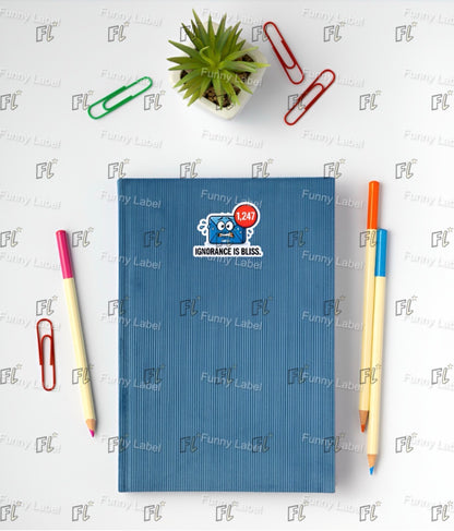 Blue notebook with a sticker, two pens, and paper clips on a white background