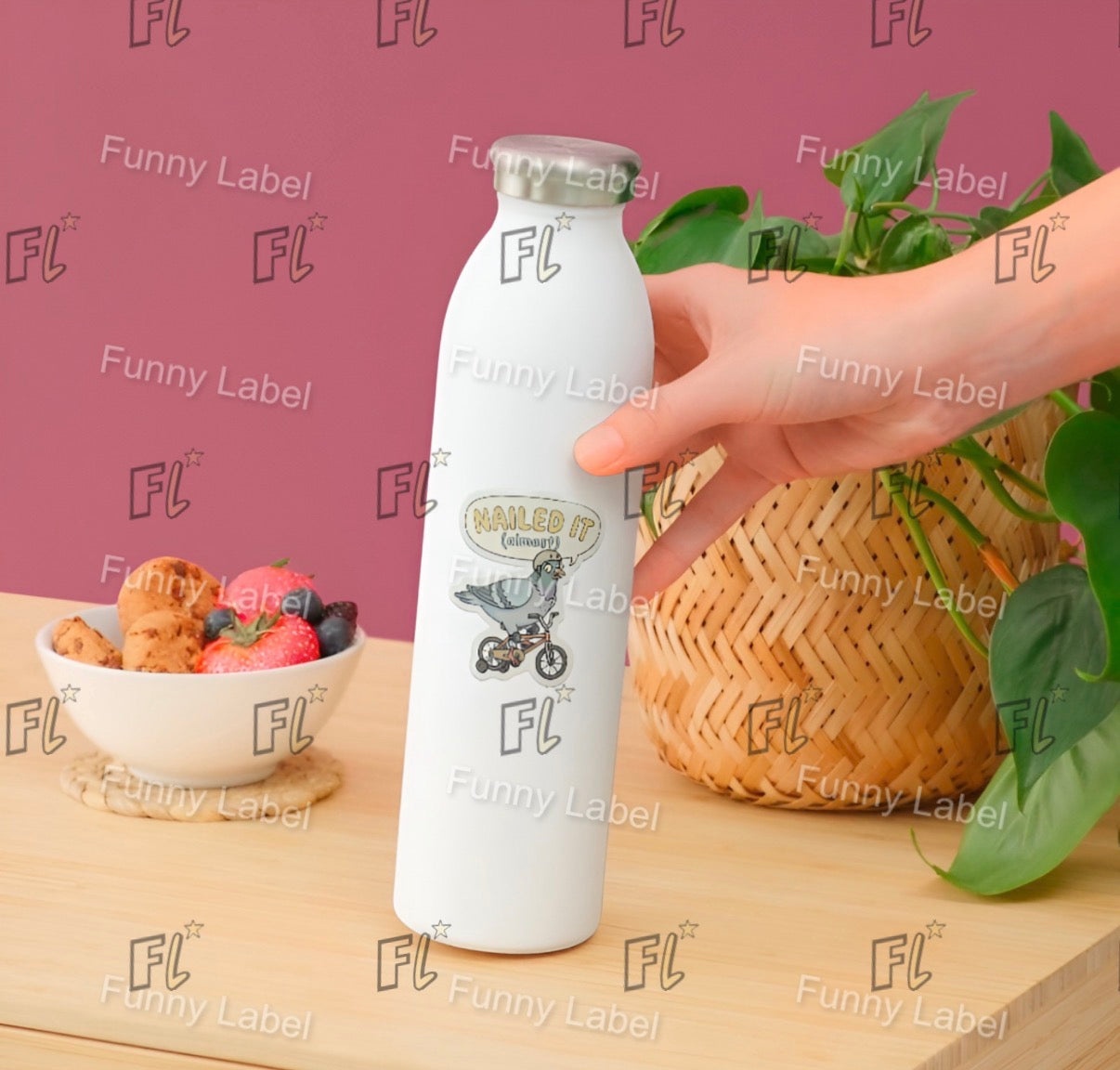 Hand holding a white bottle with 'Funny Label' branding on a wooden table with a bowl of fruit and basket in the background.