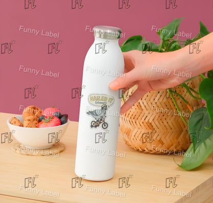 Hand holding a white bottle with 'Funny Label' branding on a wooden table with a bowl of fruit and basket in the background.