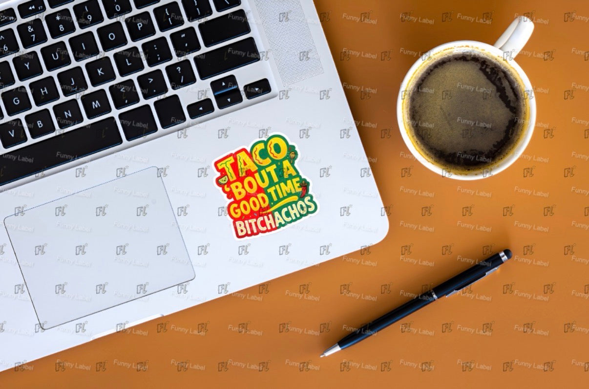 Laptop with a sticker, coffee cup, and pen on a wooden surface