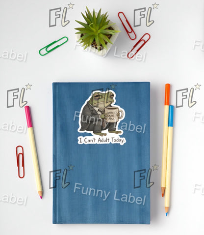 Blue notebook with a bear sticker and stationery items on a white background