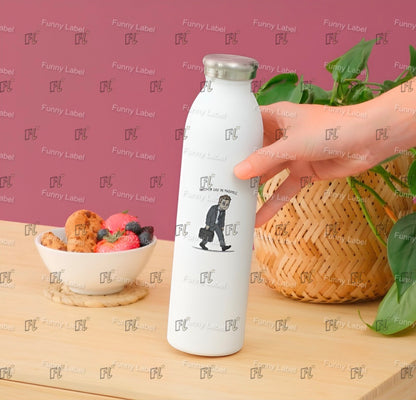 White bottle with a design on a wooden surface with a pink background featuring 'Funny Label' branding.