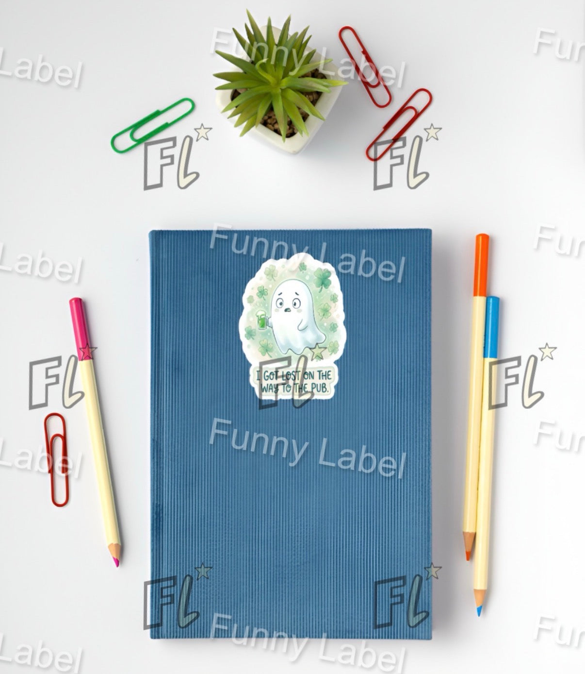 Blue notebook with a hedgehog design on a white background with stationery items.