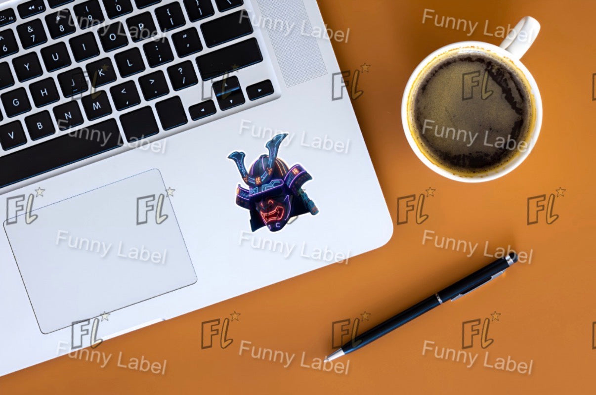 Laptop with a Neon Samurai Helmet sticker on a desk with a coffee cup and pen, all branded with 'Funny Label'.