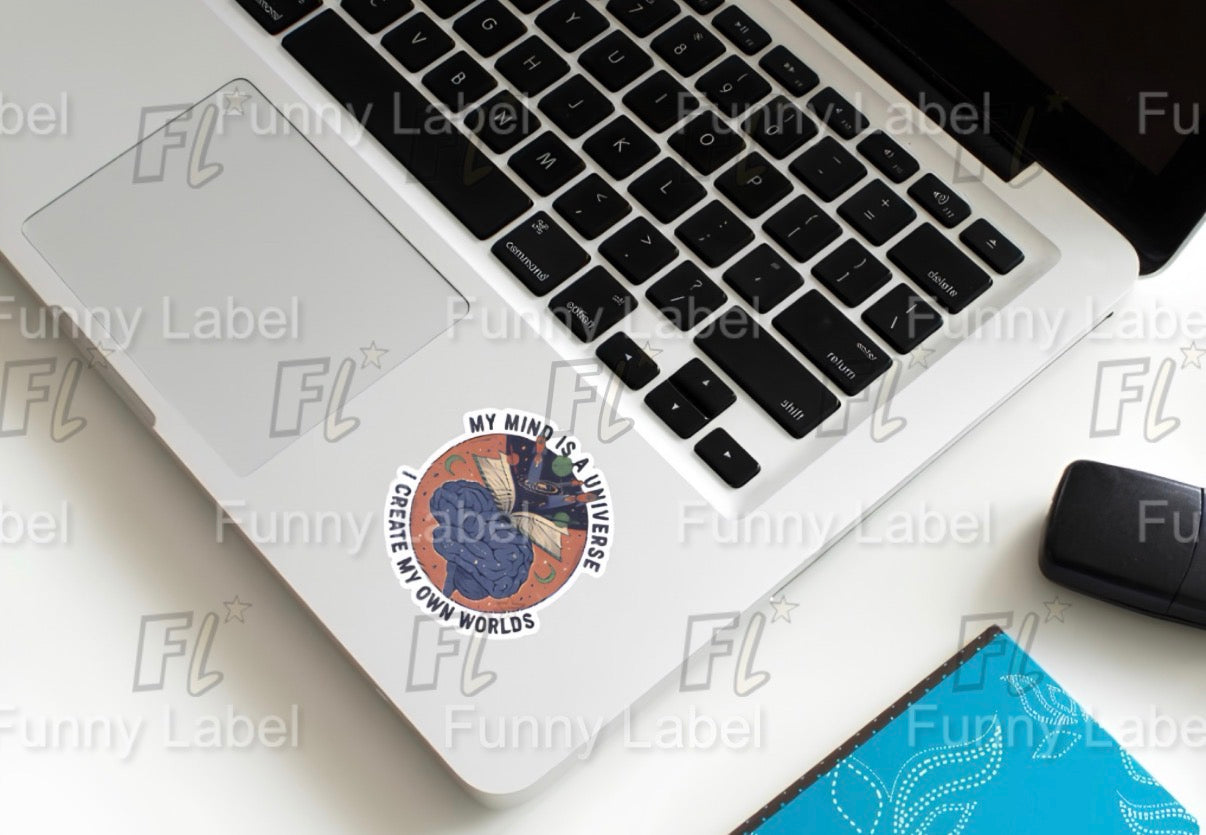Laptop with a sticker on a white surface, featuring the brand 'FL'.
