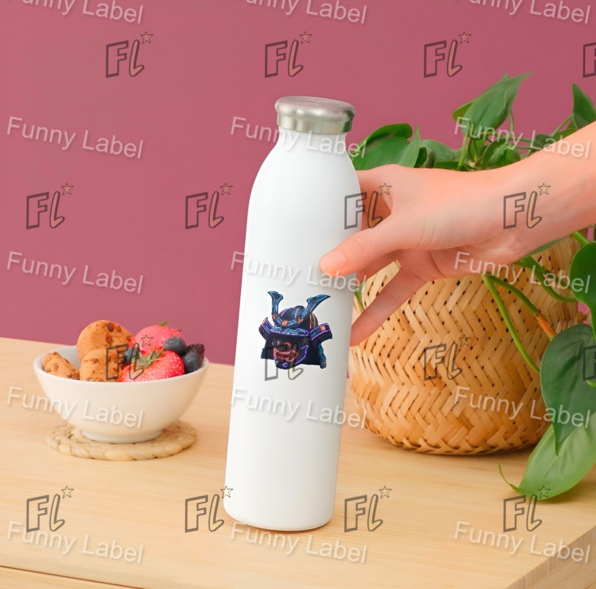 White bottle with a logo being held on a table with a bowl of fruit and a basket, against a pink background with 'Funny Label' branding.