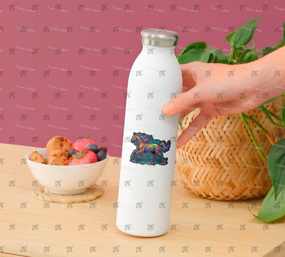 White water bottle with a colorful design held by a hand on a wooden surface with a bowl of fruit and a woven basket.