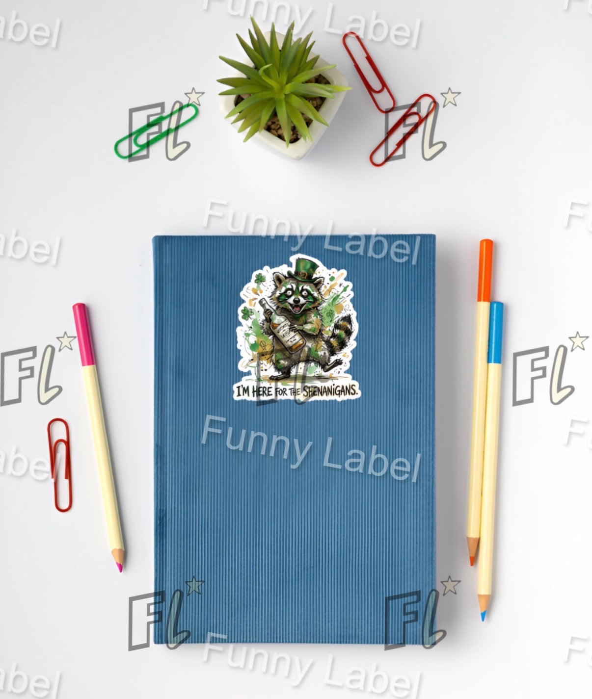 Blue notebook with a sticker, surrounded by stationery items on a white background with 'Funny Label' branding.