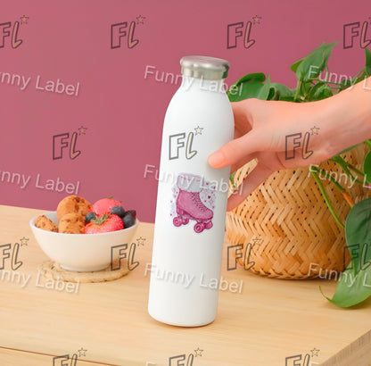 White water bottle with pink roller skate design held by a hand on a wooden surface with a bowl of snacks and plant.