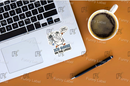 Laptop with stickers on a brown surface with a cup of coffee