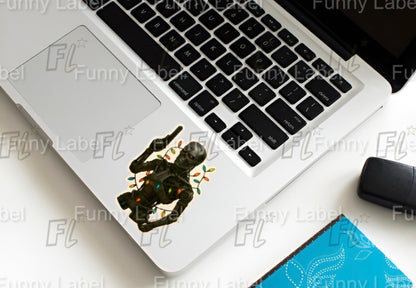 Terminator Christmas Lights Sticker – T-800 Robot Skull Holiday Label with Gun & Festive Lights
