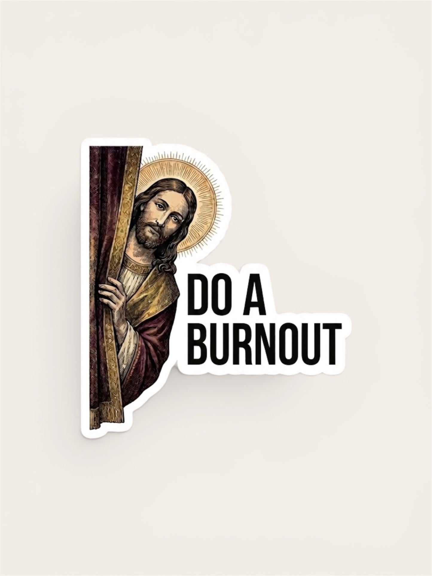 A flat, isolated vinyl sticker based on the file Do a burnout with the background.jpeg featuring a classical, woodcut-style illustration of Jesus with a detailed golden halo, peeking out from behind a dark burgundy curtain and looking directly outward next to bold black text reading "DO A BURNOUT".