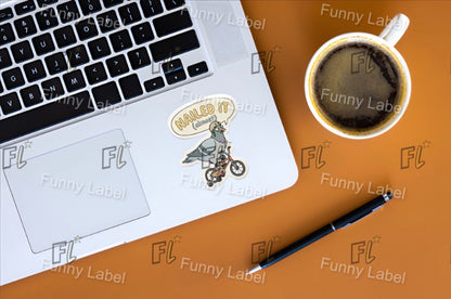 Laptop with stickers on a desk next to a cup of coffee and pen, with 'Funny Label' branding.