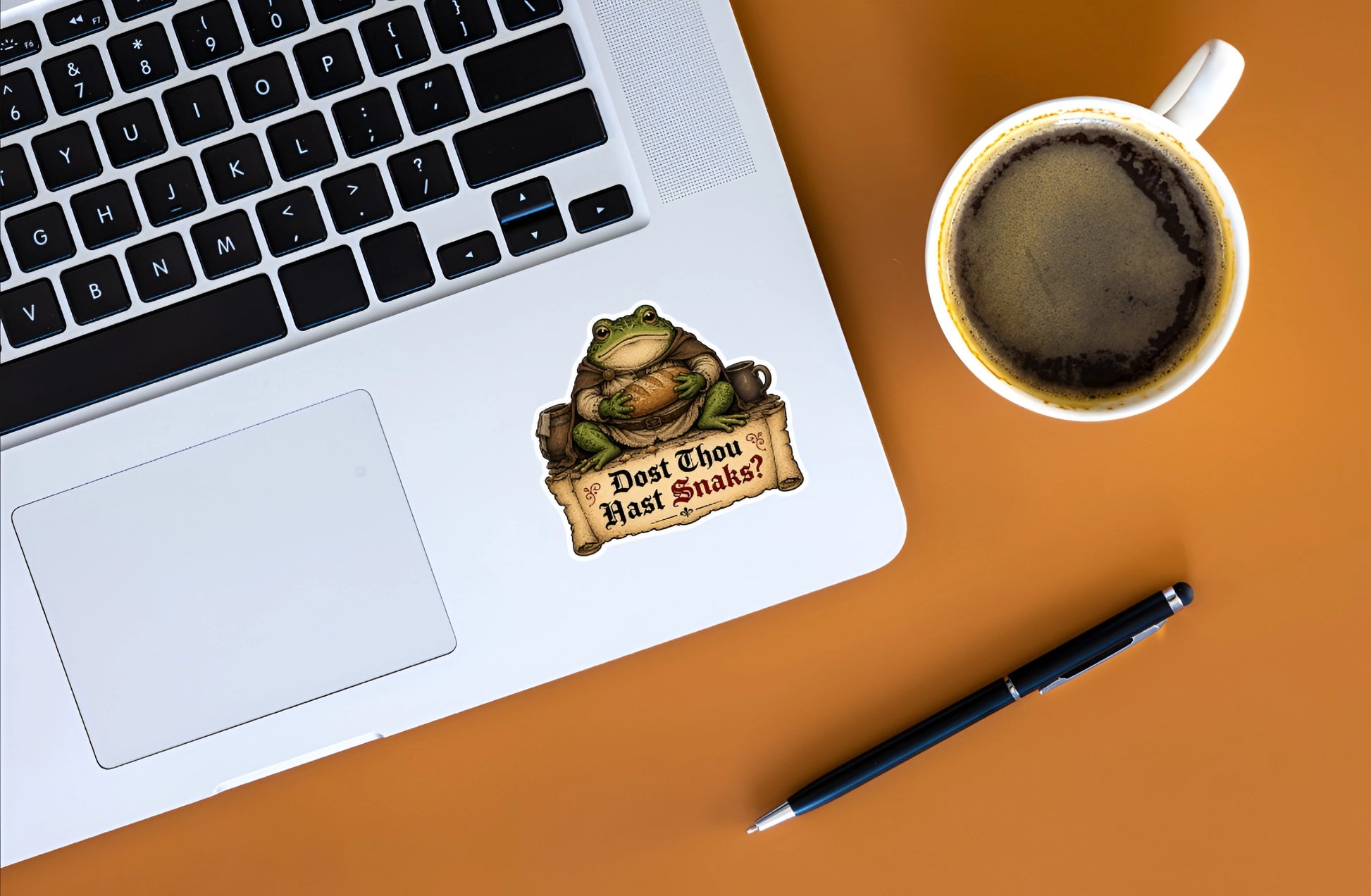 Dost Thou Hast Snaks medieval frog sticker displayed on a silver laptop.