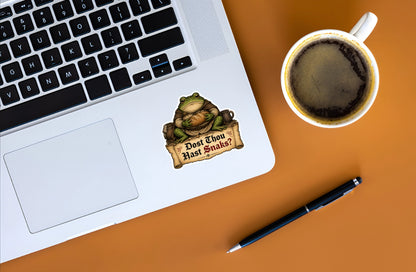 Dost Thou Hast Snaks medieval frog sticker displayed on a silver laptop.