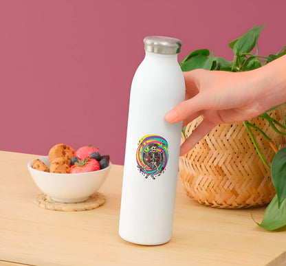 White water bottle with colorful design held by a hand on a wooden surface with a bowl of snacks and a plant in the background.