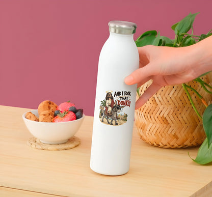 And I Took That Donkey funny Christian vinyl sticker displayed on a white water bottle