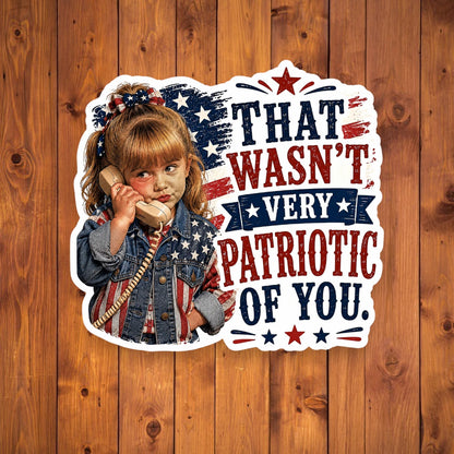 A flat, isolated vinyl sticker based on the file Patriotic of you with background.webp featuring a detailed cartoon illustration of a sassy little girl holding a retro telephone receiver next to a distressed American flag background and bold red and blue typographic text reading "THAT WASN'T VERY PATRIOTIC OF YOU."