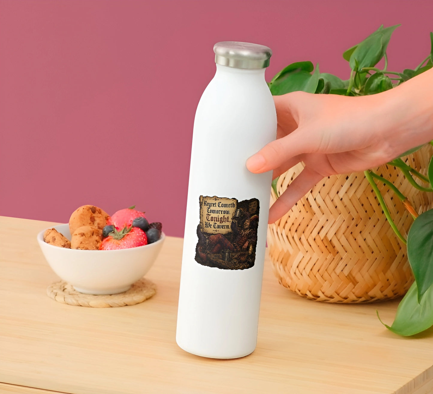 Regret Cometh Tomorrow medieval tavern jester vinyl sticker displayed on a white water bottle