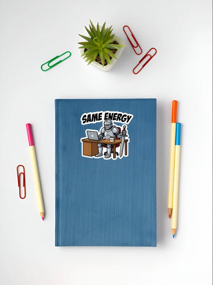 Same Energy knight meme sticker placed on a blue notebook