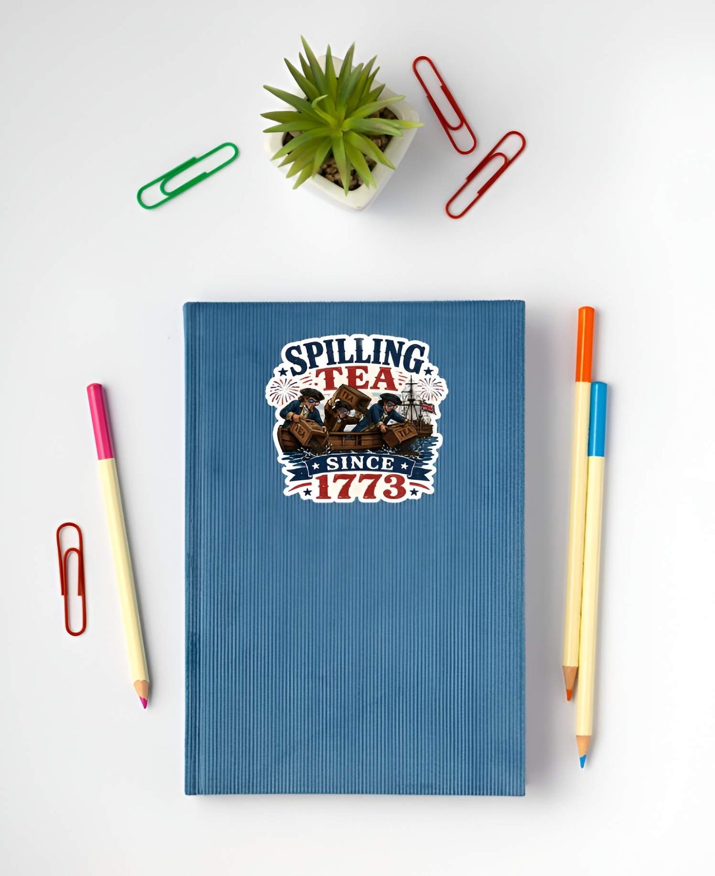 A flat, isolated vinyl sticker based on the file Spilling Tea with background.webp featuring a patriotic parody of the Boston Tea Party, showing three colonial men in a wooden rowboat wearing American flag sunglasses and dumping crates of tea into the harbor with a large ship behind them, surrounded by fireworks, stars, and bold text reading "SPILLING TEA SINCE 1773".