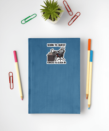Blue notebook with a sticker on a white surface with stationery items.