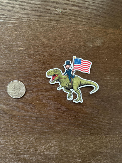 Abraham Lincoln Riding T-Rex Sticker - Funny Patriotic Dinosaur Decal - USA Flag History Vinyl Sticker - Lincoln on T-Rex with Flag Sticker