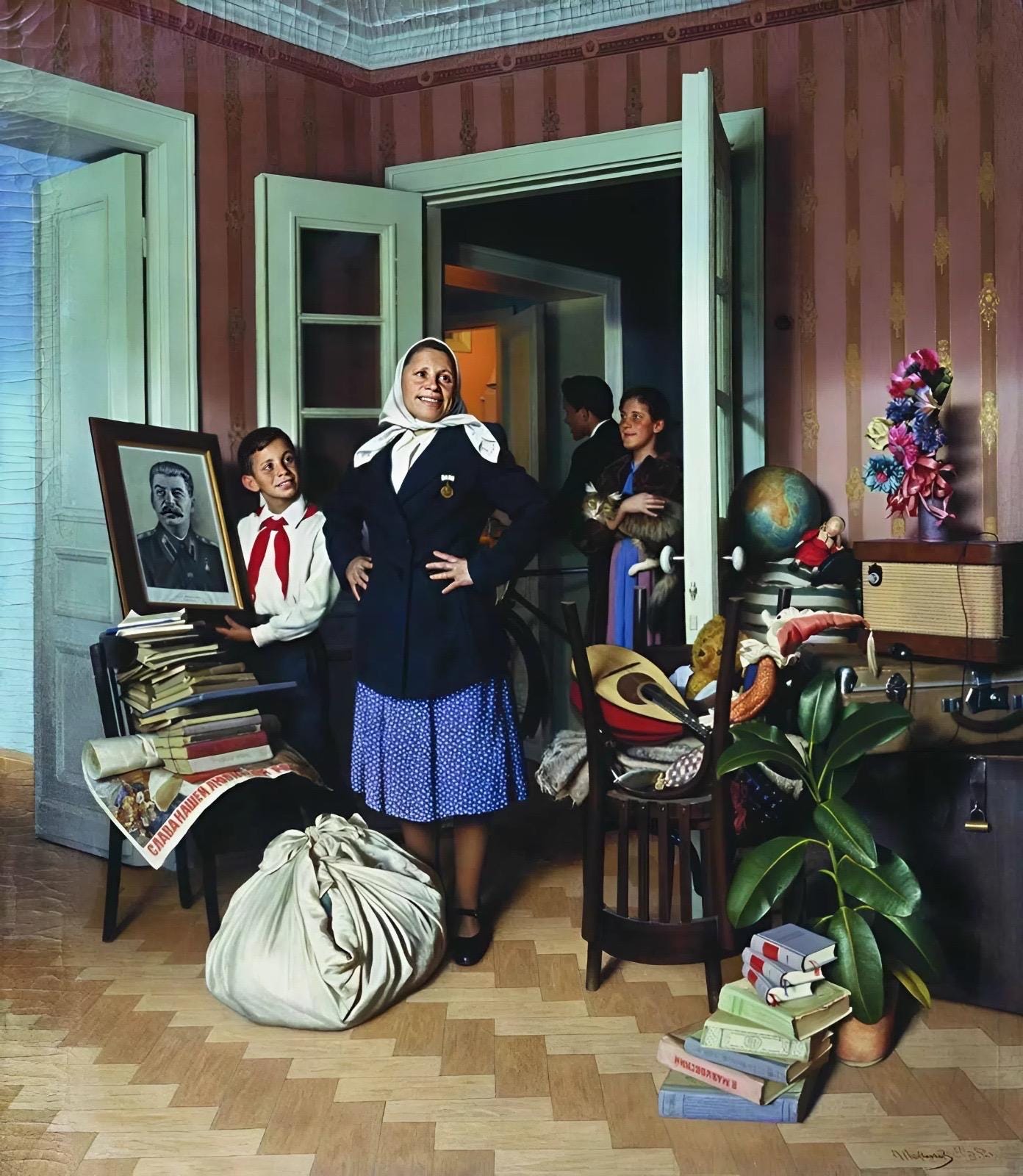 Woman in a room with books, a globe, and a portrait