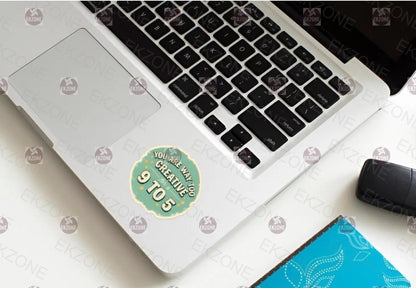 Laptop with a sticker on a white surface