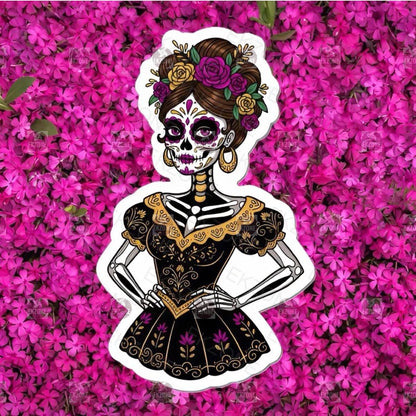 A flat, isolated vinyl sticker featuring an elegant Calavera Catrina sugar skull wearing a beautifully detailed, colorful flower crown in traditional Mexican folk art style.