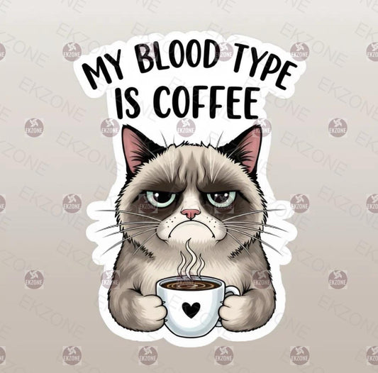 Sticker of a grumpy cat holding a coffee cup with 'My Blood Type is Coffee' text on a beige background.