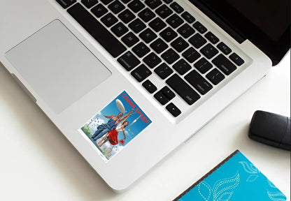 Laptop with a beach-themed sticker on the palm rest area